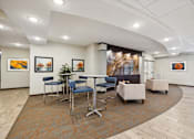 Thumbnail 9 of 24 - A conference room with a long table and chairs.