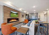 Thumbnail 10 of 24 - A modern living room with a fireplace and a television displaying a golf course.