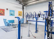 Thumbnail 11 of 26 - Bicycle storage and repair room with workspace at Hello Apartments, Minneapolis, Minnesota