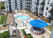 Thumbnail 4 of 26 - Aerial view of courtyard pool and outdoor amenity deck at Hello Apartments, Minneapolis, MN
