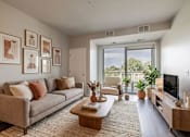 Thumbnail 20 of 26 - Living room with balcony and natural light at Hello Apartments, Minnesota, 55427