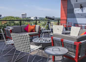 Thumbnail 5 of 26 - Rooftop lounge with telescope and city views at Hello Apartments, Minnesota