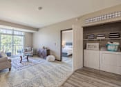 Thumbnail 8 of 10 - Carpeted Living Room at The Cielo Apartments, Fridley, Minnesota