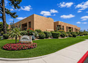 Thumbnail 2 of 23 - A building with a sign that says Pointe in front of it.