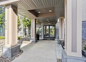 Thumbnail 3 of 25 - A building entrance with a concrete floor and a roof at Aster Meadow, Vadnais Heights, MN, 55127