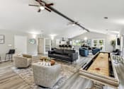 Thumbnail 2 of 14 - A room with a pool table and a ceiling fan.