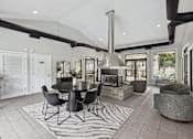 Thumbnail 1 of 16 - A modern kitchen with a black table and chairs.