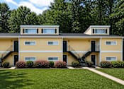 Thumbnail 3 of 17 - A yellow house with black railings and steps.