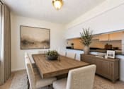Thumbnail 13 of 17 - A dining room with a wooden table and chairs.