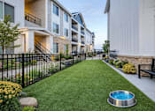Thumbnail 12 of 25 - Pet friendly courtyard with artificial turf at Connect at First Creek Apartments, Denver, 80249