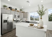 Thumbnail 9 of 16 - A modern kitchen with a large island and stainless steel appliances.