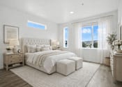 Thumbnail 8 of 16 - A bedroom with a large bed, nightstands, and a window overlooking the city.