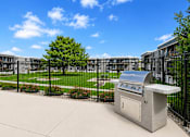 Thumbnail 6 of 26 - Outdoor grilling with courtyard view at Park Station Apartments, Midvale, UT 84047