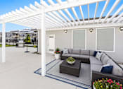 Thumbnail 10 of 26 - Outdoor lounge area with white pergola at Park Station Apartments, Midvale