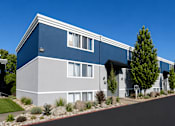 Thumbnail 11 of 26 - Modern apartment building exterior with blue accents at Park Station Apartments, Utah