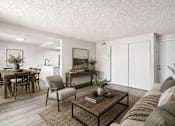 Thumbnail 21 of 26 - Open concept living and dining room with modern furnishings at Park Station Apartments, Midvale, UT