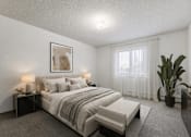 Thumbnail 19 of 23 - A bedroom with a large bed and a potted plant.