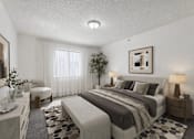 Thumbnail 20 of 23 - A bedroom with a large bed and a small tree.