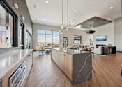 Thumbnail 12 of 39 - Open concept kitchen with large island at Sequel Homes Apartments, Colorado
