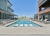 Thumbnail 15 of 39 - Resort style pool with sunken lounge seating at Sequel Homes Apartments, Englewood, 80110