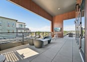 Thumbnail 9 of 39 - Rooftop terrace with lounge seating and views at Sequel Homes Apartments, Englewood