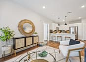 Thumbnail 24 of 39 - Open concept living area with kitchen island at Sequel Homes Apartments, Englewood, Colorado
