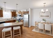 Thumbnail 14 of 18 - Open kitchen and dining area with wood floors at Cypress Court Apartments, St Cloud, Minnesota