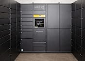 Thumbnail 9 of 18 - Package locker system in mail room at Cypress Court Apartments, St Cloud, MN 56303