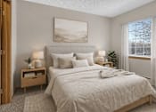 Thumbnail 12 of 14 - Cozy bedroom with neutral tones and natural light at Grand Gateway Apartments, St Cloud