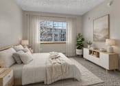Thumbnail 13 of 14 - Bright bedroom with modern furnishings at Grand Gateway Apartments, Minnesota