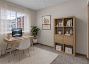 Thumbnail 14 of 14 - Home office with wood desk and shelving at Grand Gateway Apartments, St Cloud, MN