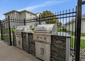 Thumbnail 22 of 40 - Community grilling station with stainless steel bbqs at Prosper West Apartments, Waite Park