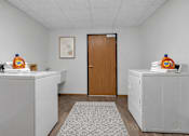 Thumbnail 24 of 40 - Laundry room with washers and dryers at Prosper West Apartments, Waite Park, Minnesota