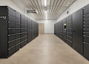 Thumbnail 28 of 40 - Package locker room with secure storage compartments at Prosper West Apartments, Minnesota