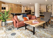 Thumbnail 5 of 25 - Modern clubhouse with lounge seating and billiards at Regency Park Apartments, St Cloud, MN 56304