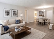 Thumbnail 17 of 25 - Open concept living and dining area with wood style flooring at Regency Park Apartments, St Cloud, Minnesota