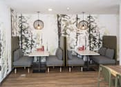 Thumbnail 4 of 25 - Private dining booths with forest mural wallpaper at Regency Park Apartments, St Cloud, MN