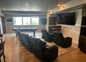 Thumbnail 53 of 56 - a living room with a pool table and a tv