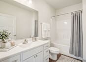 Thumbnail 22 of 23 - White Bathroom at Cedar Green, Blaine, Minnesota