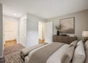 Thumbnail 18 of 21 - Master bedroom with ensuite bathroom and neutral tones at Northview Park Apartments, Sterling Heights