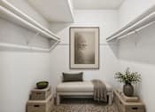 Thumbnail 12 of 13 - Walk-in closet with bench and shelving at Stratford Arms Apartments, Riverdale, 30274