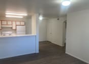 Thumbnail 1 of 13 - a kitchen and living room of an empty apartment
