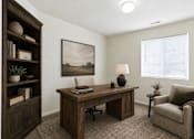 Thumbnail 15 of 16 - A room with a desk, chair, and a painting on the wall at Slate Canyon Apartments, Apartments, Provo, UT