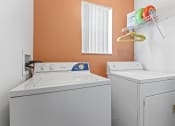 Thumbnail 12 of 23 - the laundry room has a washer and dryer and a window