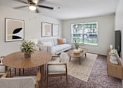Thumbnail 1 of 22 - A living room with a couch, chairs, a coffee table, and a ceiling fan.