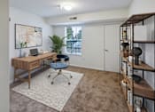 Thumbnail 4 of 22 - A room with a desk and a chair.