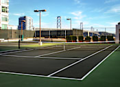 Thumbnail 25 of 40 - A tennis court with a green surface and white lines.