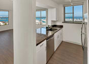 Thumbnail 32 of 40 - A kitchen with a view of the ocean.