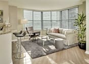 Thumbnail 5 of 40 - A modern living room with a grey rug and a white sofa.