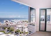 Thumbnail 57 of 95 - A balcony with a view of a harbor and buildings.